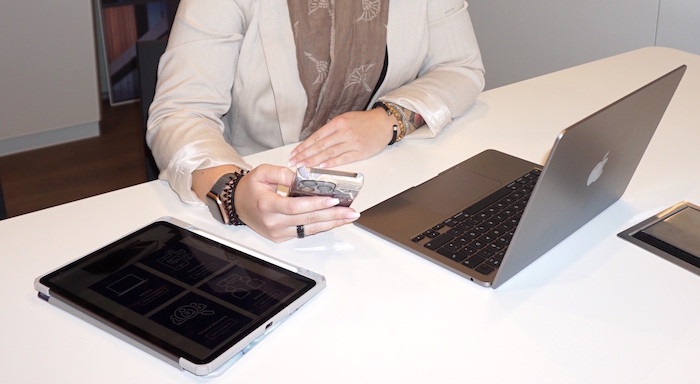 Social person holding white android smartphone
